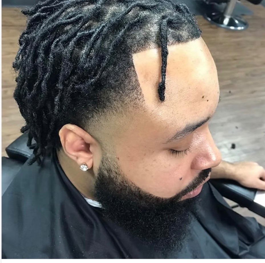 Client with short locs, sharp lined hairline and a fully shaped beard after a full service cut and beard trim